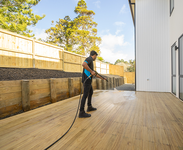 Deck cleaning services being performed